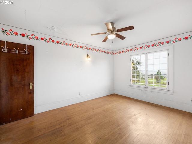 spare room with ceiling fan and hardwood / wood-style floors