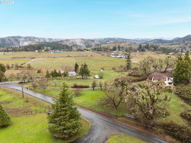 aerial view featuring a rural view and a mountain view