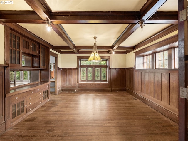 unfurnished living room featuring beamed ceiling, coffered ceiling, and dark hardwood / wood-style flooring