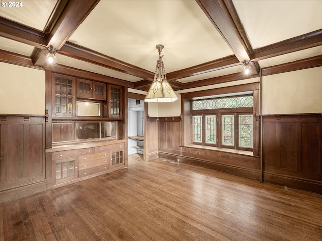 unfurnished living room with wood-type flooring, coffered ceiling, and beam ceiling