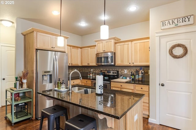 2839 25th Ave, Forest Grove, OR 97116 - kitchen featuring appliances with stainless steel finishes, light brown cabinetry, backsplash, dark wood-type flooring, and a sink
