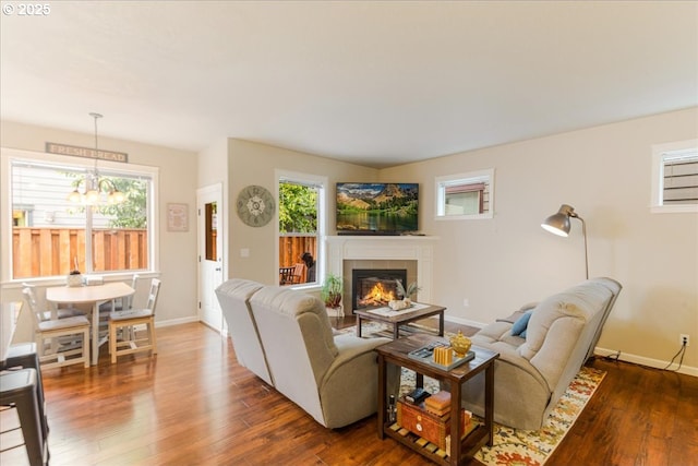 2839 25th Ave, Forest Grove, OR 97116 - living area featuring a chandelier, healthy amount of natural light, dark wood finished floors, and a tile fireplace
