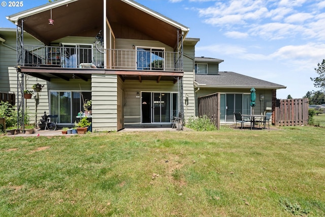 2062 NE Hogan Dr, Gresham, OR 97030 - back of house featuring a balcony and a lawn