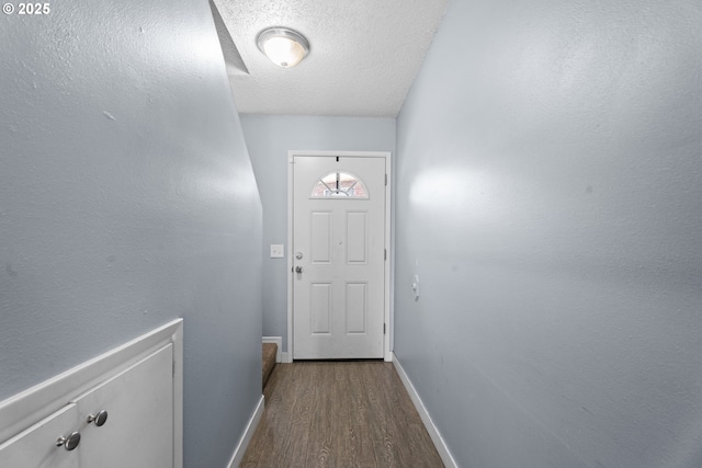 2062 NE Hogan Dr, Gresham, OR 97030 - doorway to outside with dark wood finished floors and a textured ceiling