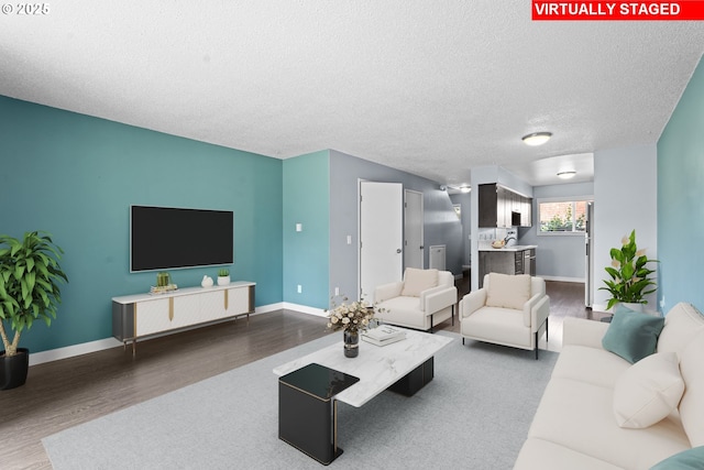 2062 NE Hogan Dr, Gresham, OR 97030 - living area with wood finished floors and a textured ceiling