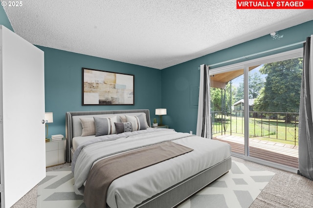 2062 NE Hogan Dr, Gresham, OR 97030 - carpeted bedroom with access to exterior and a textured ceiling