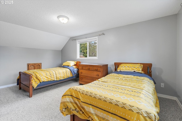 carpeted bedroom with vaulted ceiling and a textured ceiling