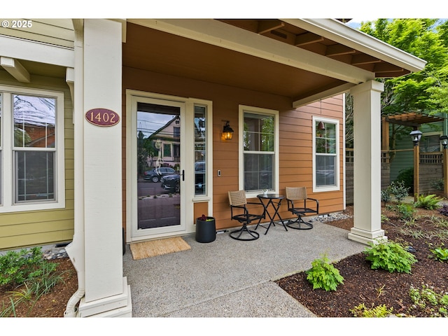 view of exterior entry with a porch