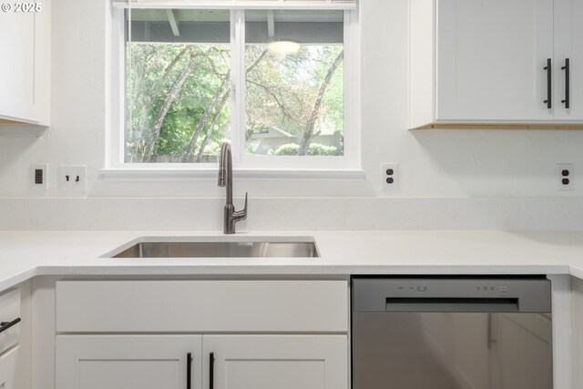 2817 Applewood Ln, Eugene, OR 97408 - kitchen featuring dishwasher, white cabinets, light countertops, and healthy amount of natural light