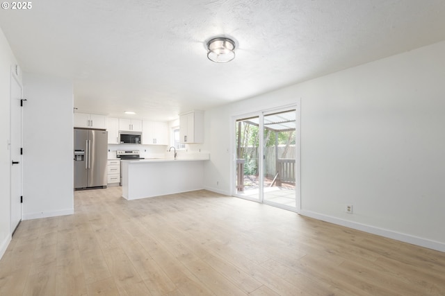 2817 Applewood Ln, Eugene, OR 97408 - unfurnished living room with light wood-style flooring