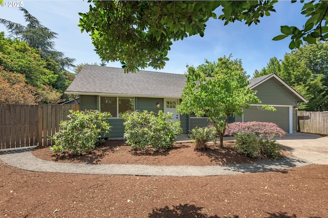 2817 Applewood Ln, Eugene, OR 97408 - obstructed view of property with a garage, a shingled roof, and driveway