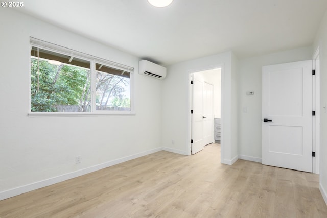 2817 Applewood Ln, Eugene, OR 97408 - unfurnished bedroom with a wall unit AC and light wood-style floors