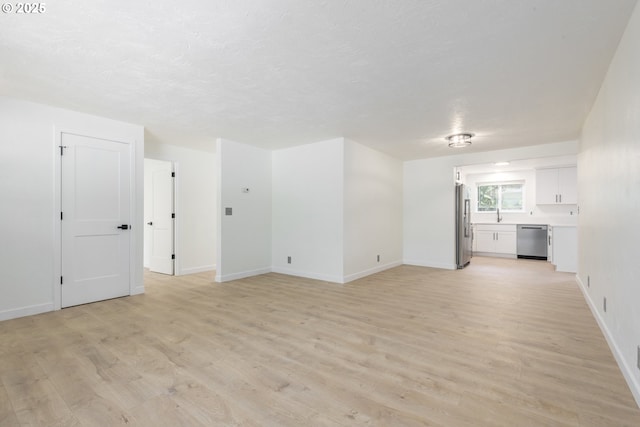 2817 Applewood Ln, Eugene, OR 97408 - unfurnished living room with light wood finished floors and baseboards