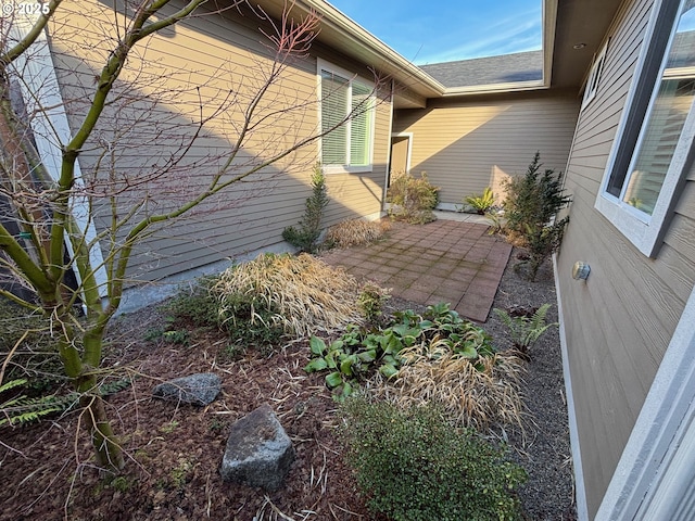 view of property exterior with a patio