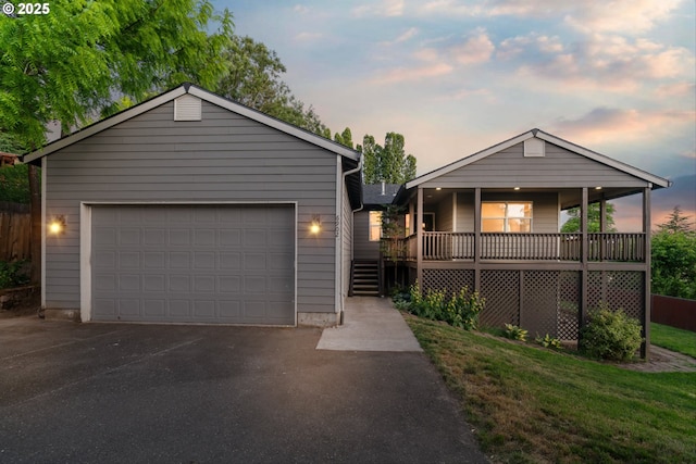 6902 SW Taylors Ferry Rd, Portland, OR 97223 - view of front of home with a garage and covered porch