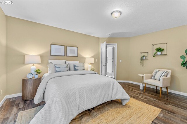 6902 SW Taylors Ferry Rd, Portland, OR 97223 - bedroom featuring baseboards and dark wood-style flooring
