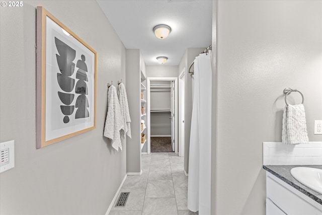 6902 SW Taylors Ferry Rd, Portland, OR 97223 - hall featuring baseboards and a sink