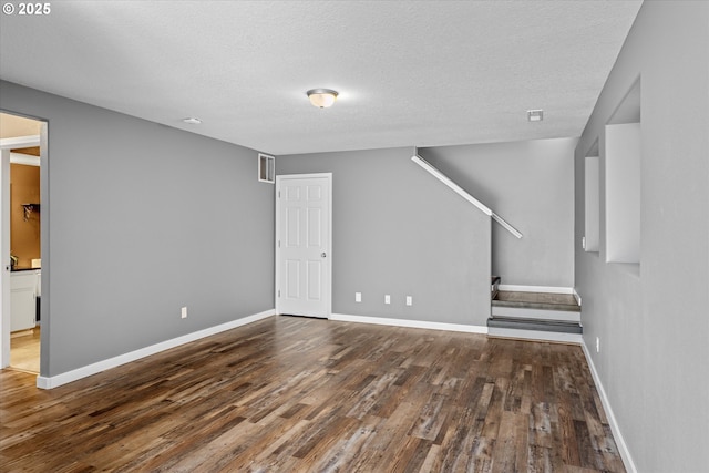 6902 SW Taylors Ferry Rd, Portland, OR 97223 - unfurnished living room with wood finished floors and a textured ceiling