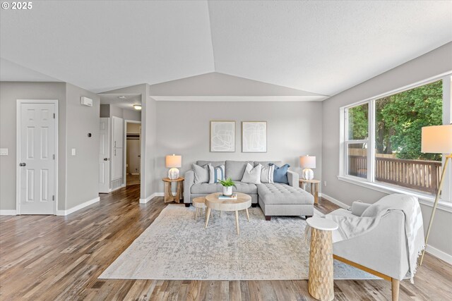 6902 SW Taylors Ferry Rd, Portland, OR 97223 - living area featuring wood finished floors and vaulted ceiling