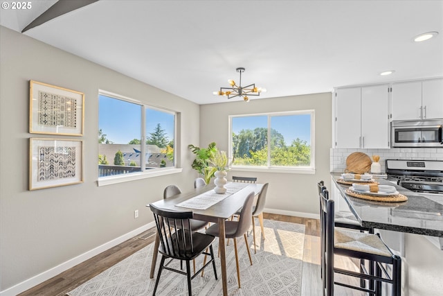 6902 SW Taylors Ferry Rd, Portland, OR 97223 - dining room with a chandelier, recessed lighting, and light wood-style floors