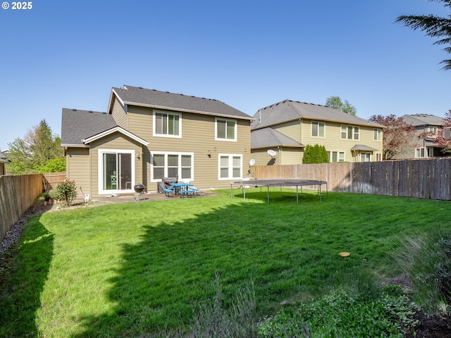 180 N The Greens Ave, Newberg, OR 97132 - rear view of property with a trampoline