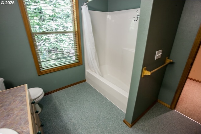 bathroom featuring vanity, toilet, shower / tub combo with curtain, and baseboards