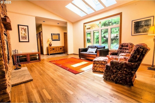 living room with wood finished floors, lofted ceiling, and a skylight