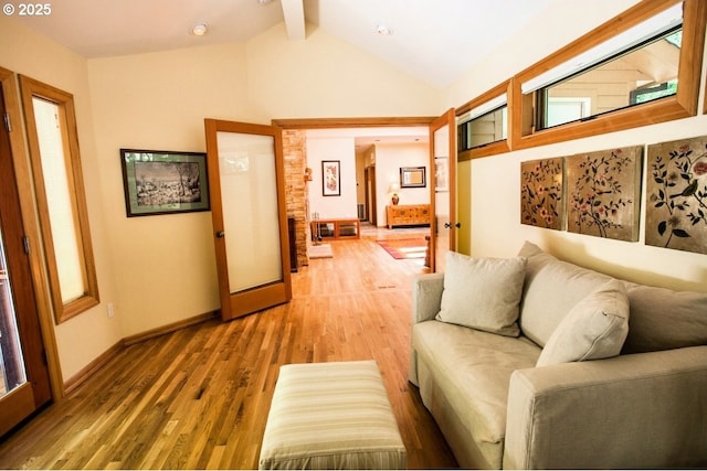 living room with light wood-style flooring and baseboards