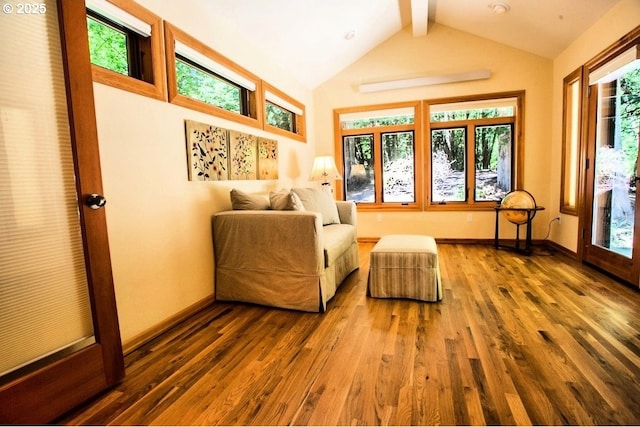 living area with wood finished floors and baseboards