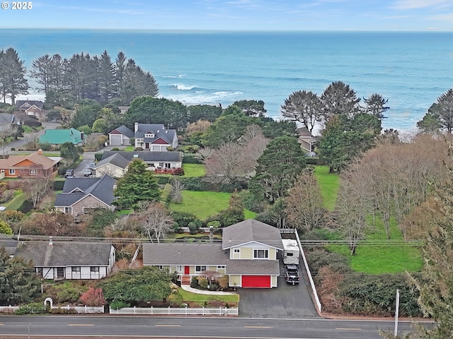 drone / aerial view with a residential view and a water view