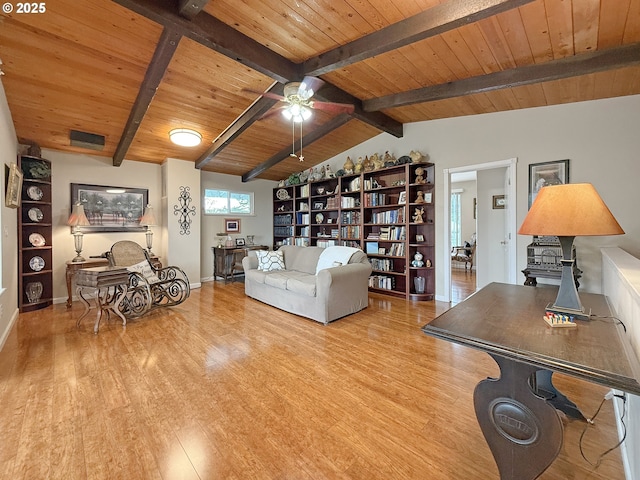 living room featuring a ceiling fan, lofted ceiling with beams, wood finished floors, baseboards, and wood ceiling