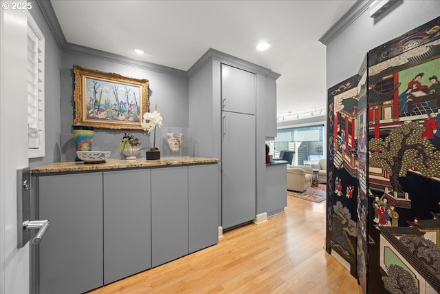 interior space with crown molding, recessed lighting, and light wood-type flooring