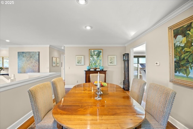 dining room with crown molding, wood finished floors, recessed lighting, and baseboards