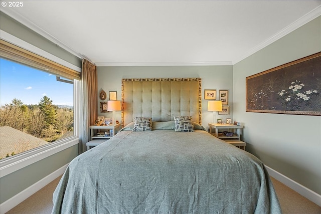 carpeted bedroom featuring baseboards and ornamental molding