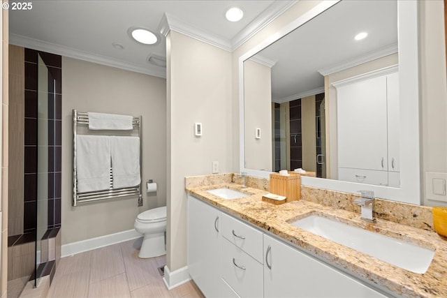 full bath featuring crown molding, toilet, a shower stall, and a sink