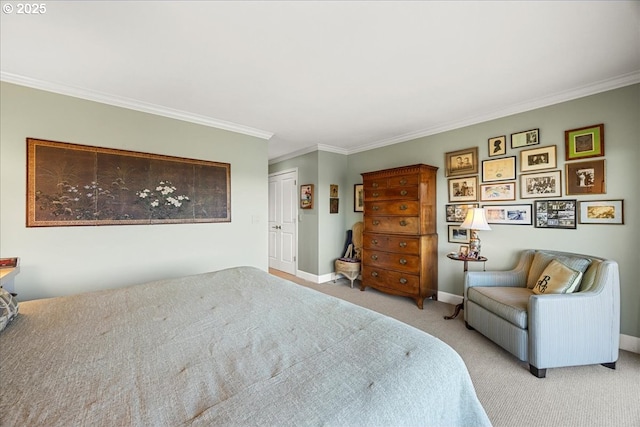 carpeted bedroom featuring a closet, baseboards, and ornamental molding