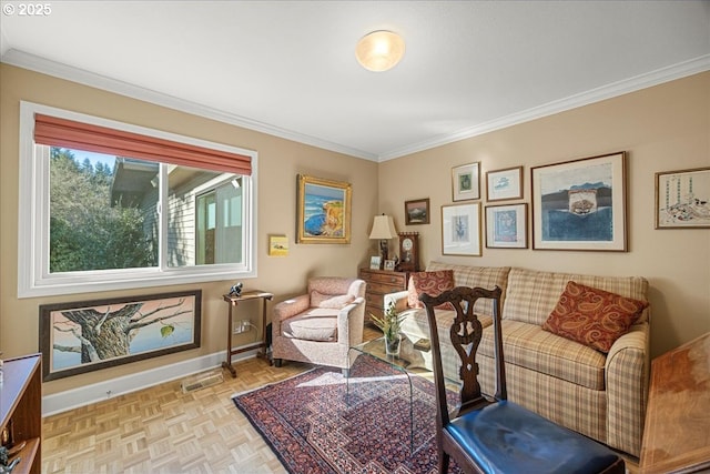 living area with baseboards and crown molding