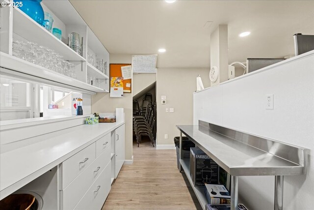 kitchen with light wood-style flooring, open shelves, white cabinetry, recessed lighting, and baseboards