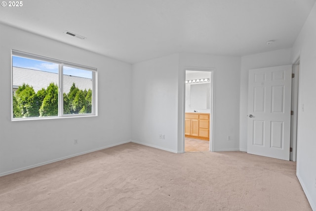1938 27th Ave, Forest Grove, OR 97116 - unfurnished bedroom featuring light colored carpet, baseboards, and ensuite bath