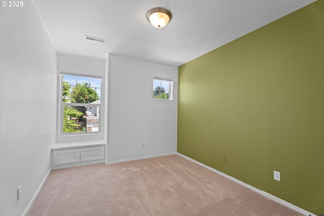 1938 27th Ave, Forest Grove, OR 97116 - empty room featuring light colored carpet, baseboards, and a textured ceiling