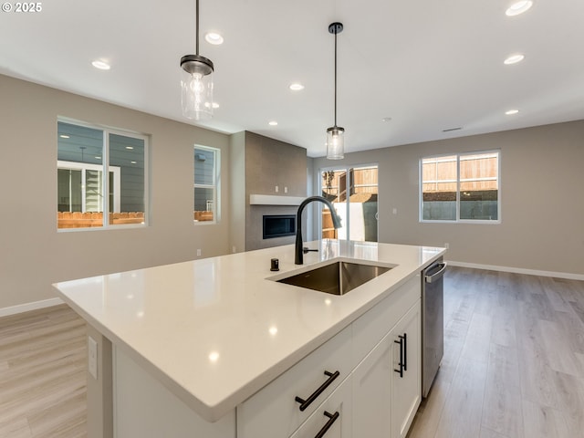 702 NW 178th Way, Ridgefield, WA 98642 - kitchen featuring a sink, dishwasher, recessed lighting, light wood-type flooring, and pendant lighting
