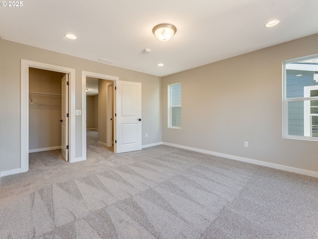 702 NW 178th Way, Ridgefield, WA 98642 - unfurnished bedroom featuring carpet floors, baseboards, a walk in closet, and recessed lighting