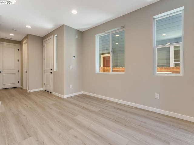 702 NW 178th Way, Ridgefield, WA 98642 - unfurnished room featuring baseboards, light wood-type flooring, and recessed lighting