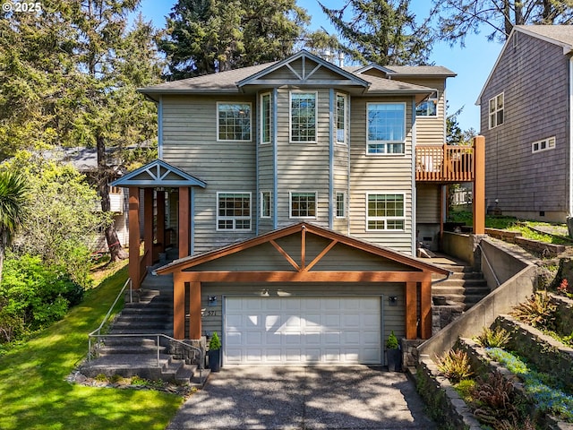 view of front of house featuring a front lawn, stairway, and aphalt driveway
