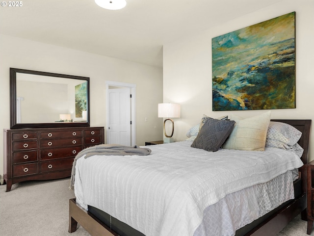 bedroom with light colored carpet