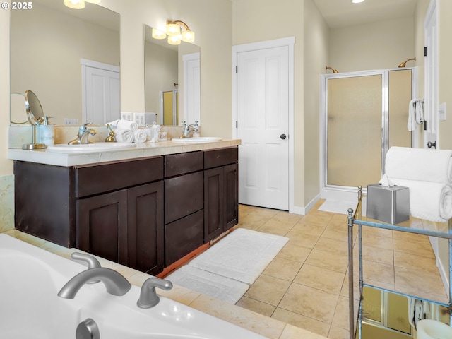 full bath featuring tile patterned flooring, a sink, a stall shower, and double vanity