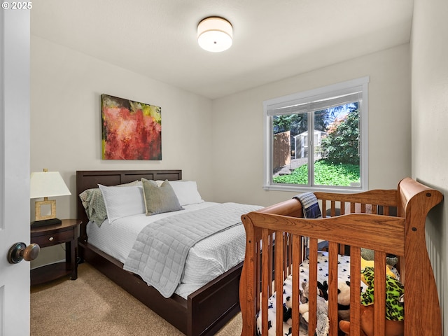 bedroom featuring light colored carpet