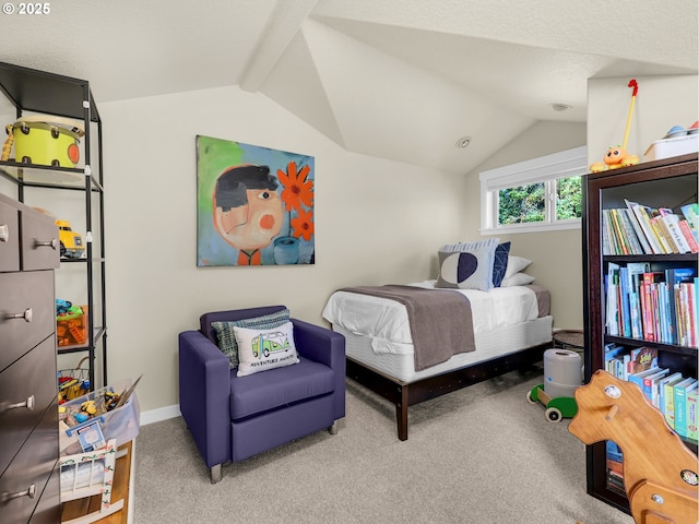 carpeted bedroom with baseboards and lofted ceiling