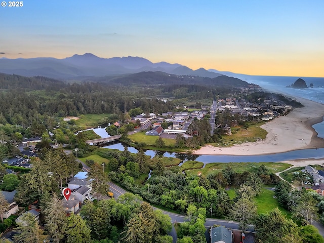 571 Antler Rd, Cannon Beach, OR 97110 - aerial overview of property's location with a water and mountain view