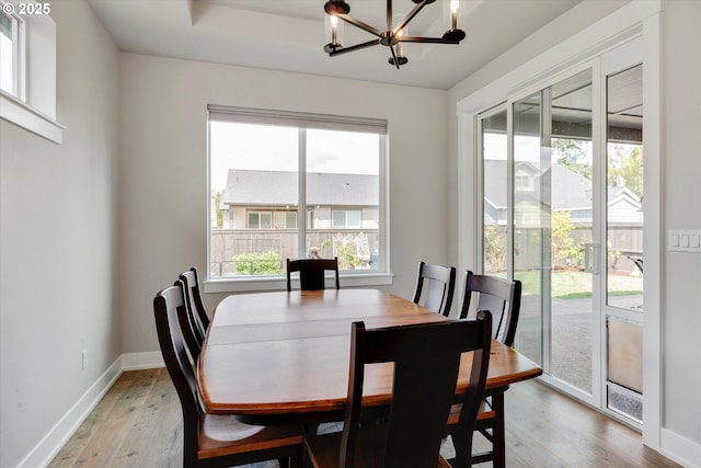 1332 SE 14th Ave, Canby, OR 97013 - dining space with a chandelier, light wood-style flooring, and baseboards